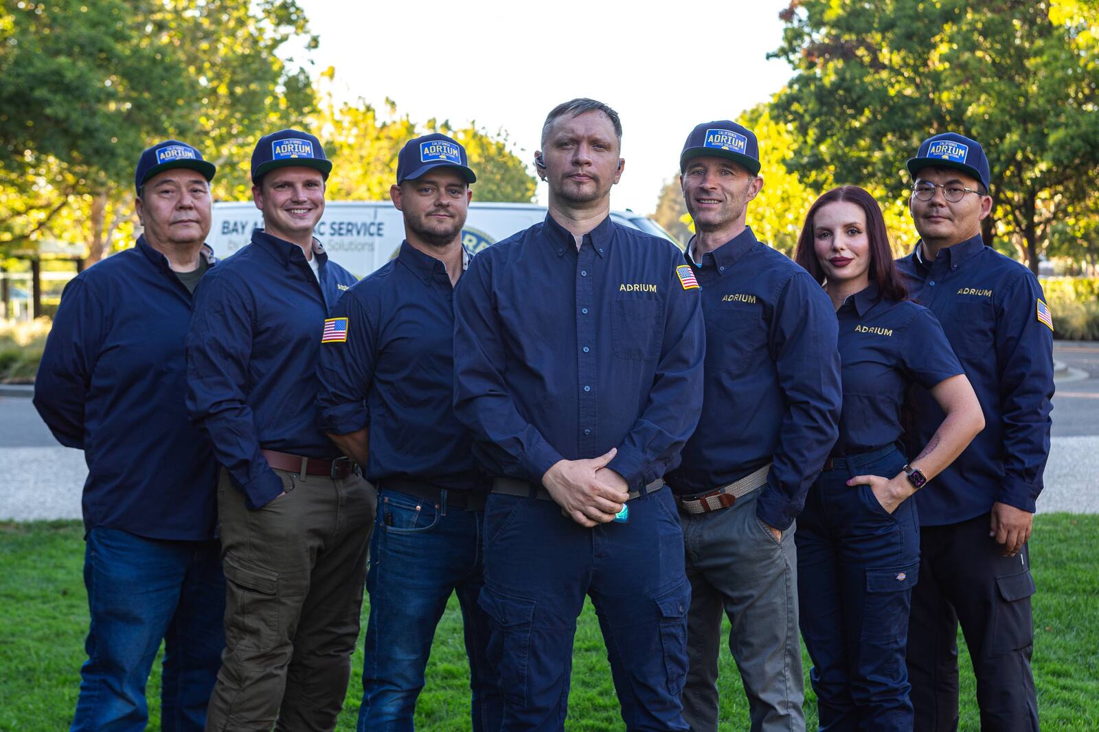 The ADRIUM Service Solutions crew in uniform, owner Andrew Kuznetsov in front