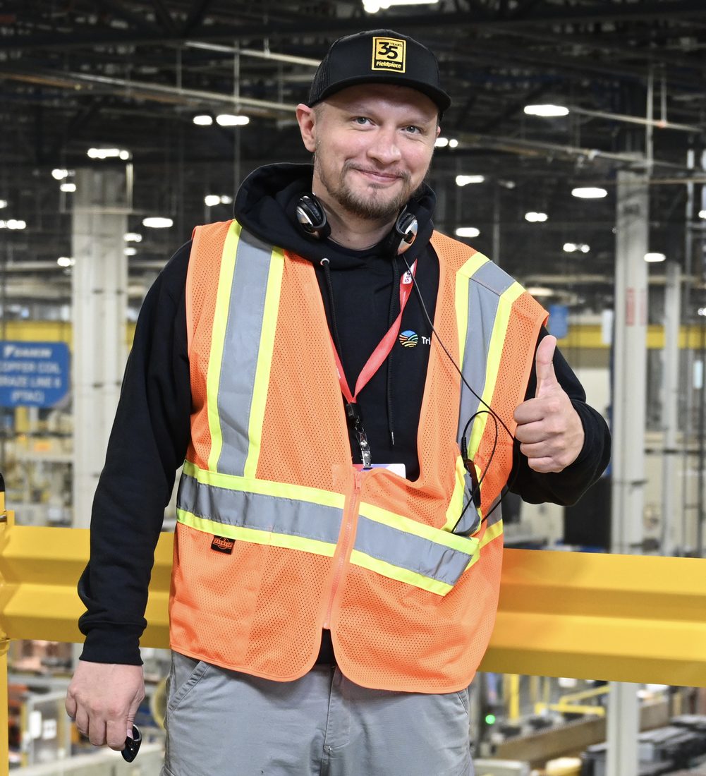 Andrew Kuznetsov, owner of Bay Area Coffee Service, in a safety vest during manufacturer service training