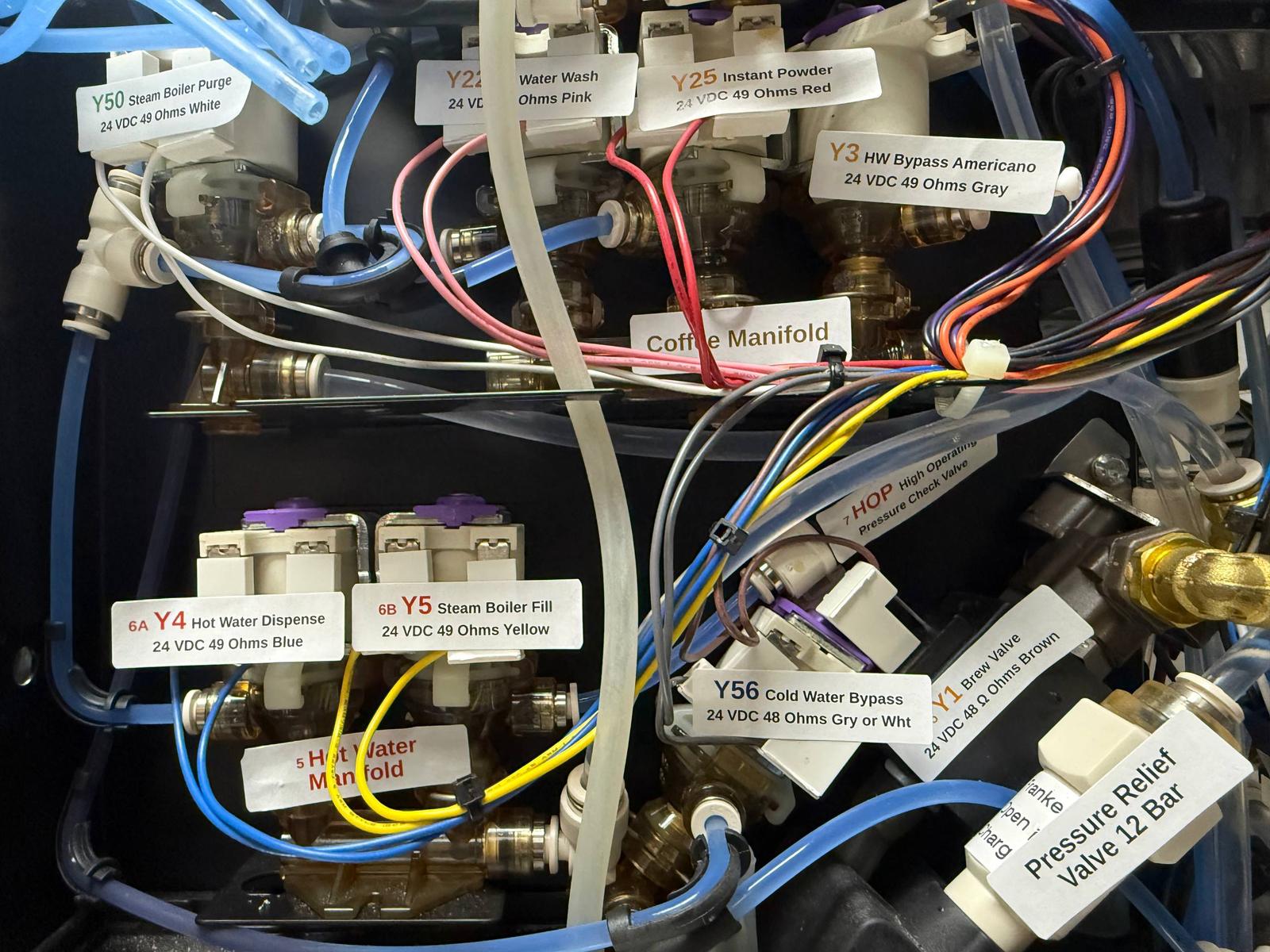 Labeled coffee manifold and valve connections inside a Franke machine