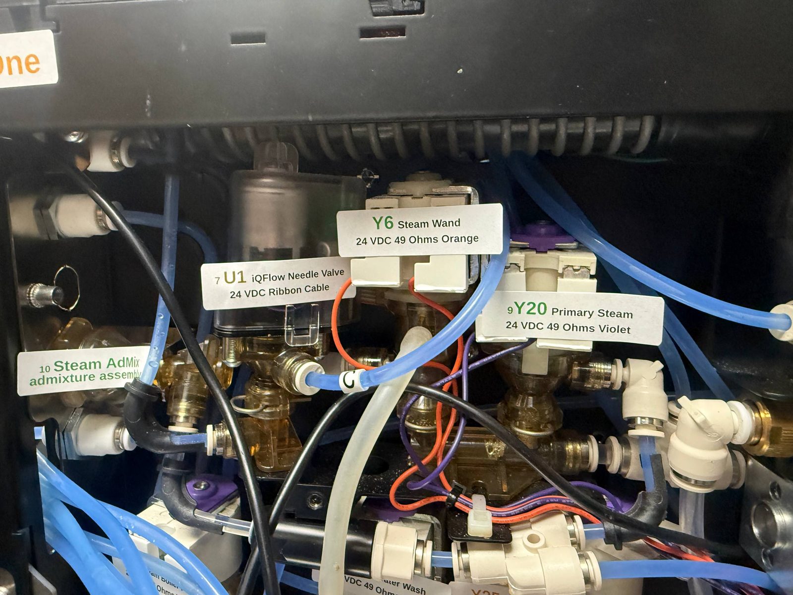 Labeled steam and iQFlow valve components inside a Franke coffee machine