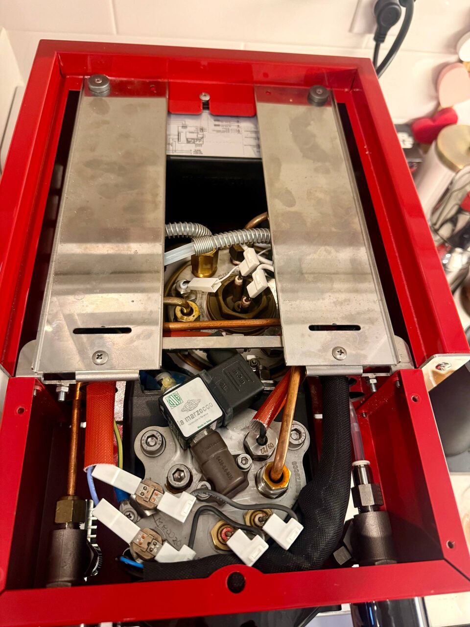 La Marzocco Linea Micra with the top panel open, boiler and group exposed during service