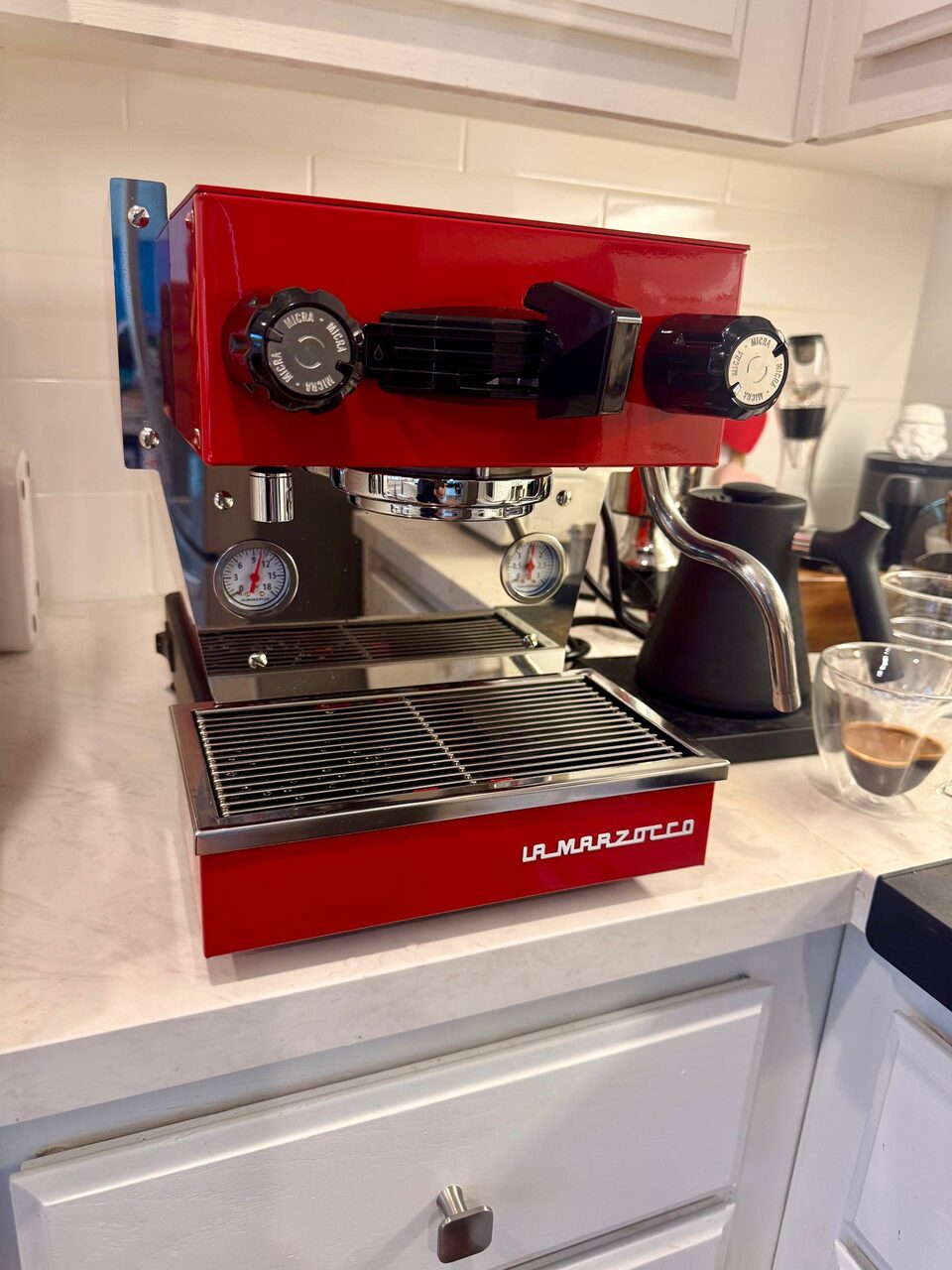 Red La Marzocco Linea Micra on a kitchen counter, front view