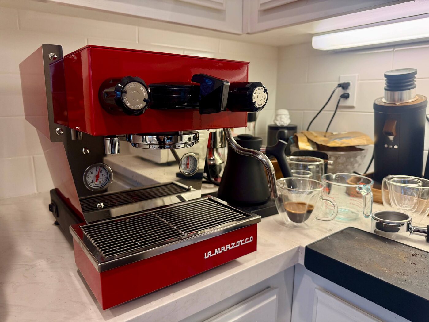 Red La Marzocco Linea Micra pulling espresso at a client's home after service